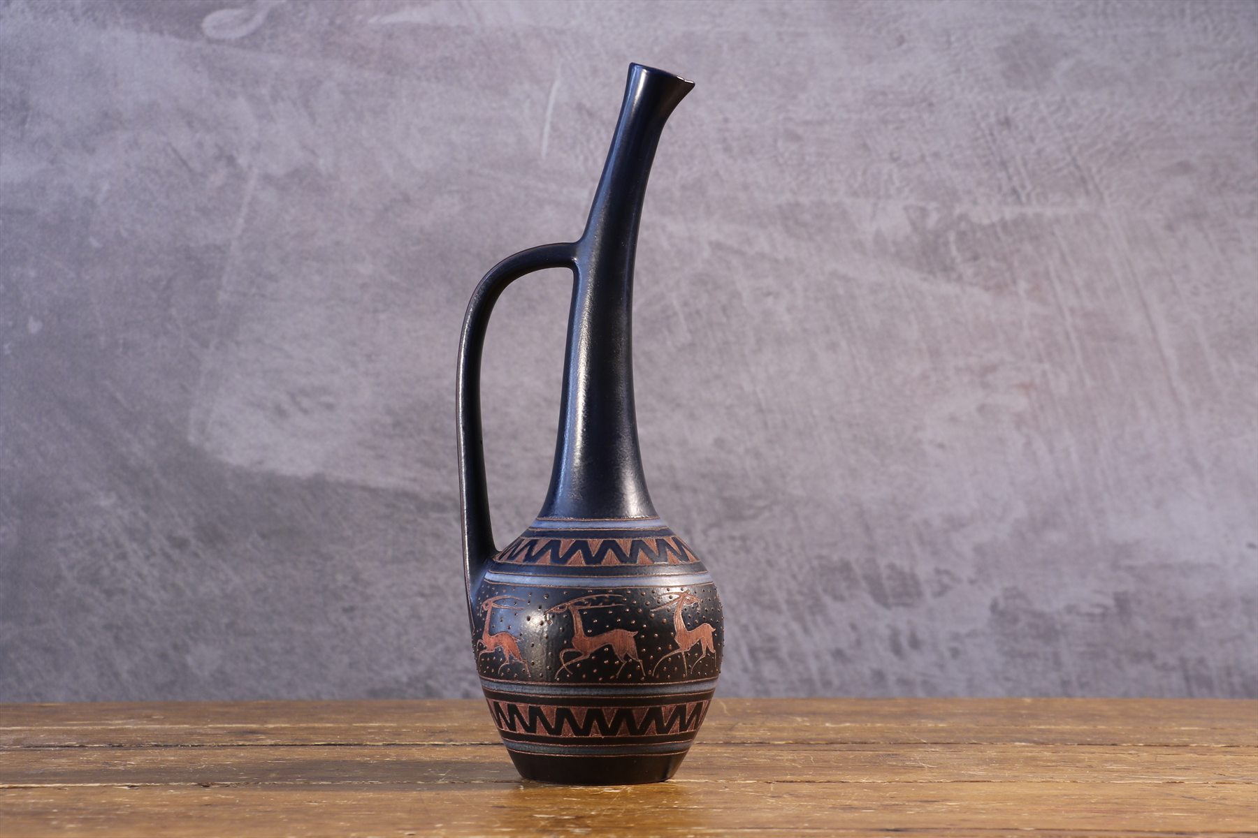 Midnight Blue Ceramic Pitcher with Deer Frieze