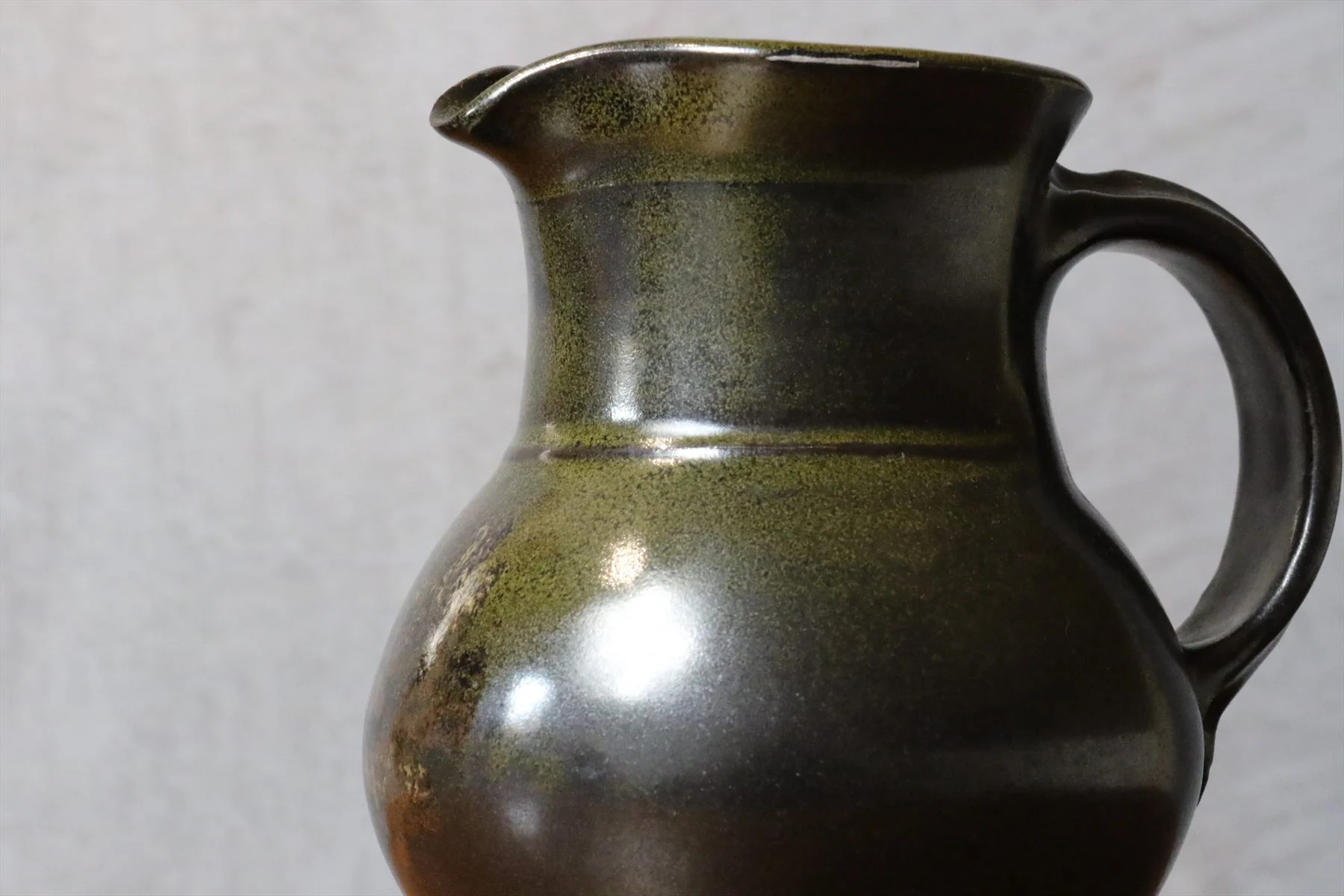 Black Glazed Ceramic Pitcher with Green Glints